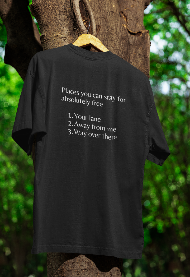 Black t shirt hanging in a tree with the words places you can stay for absolutely free