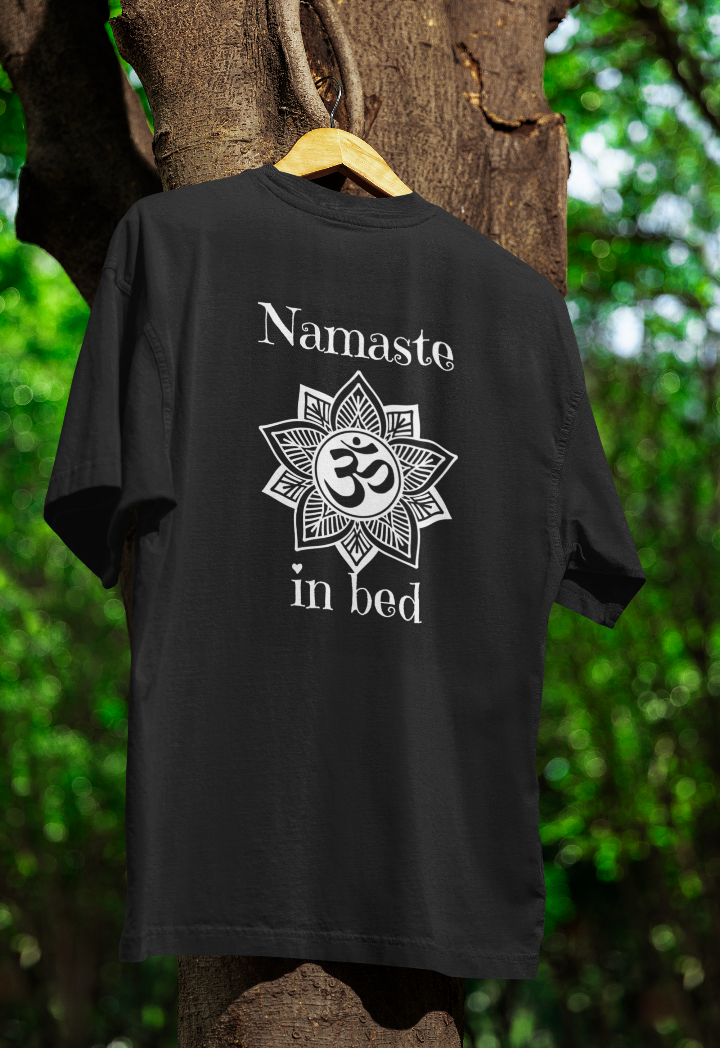 Black t shirt with the words Namaste in Bed