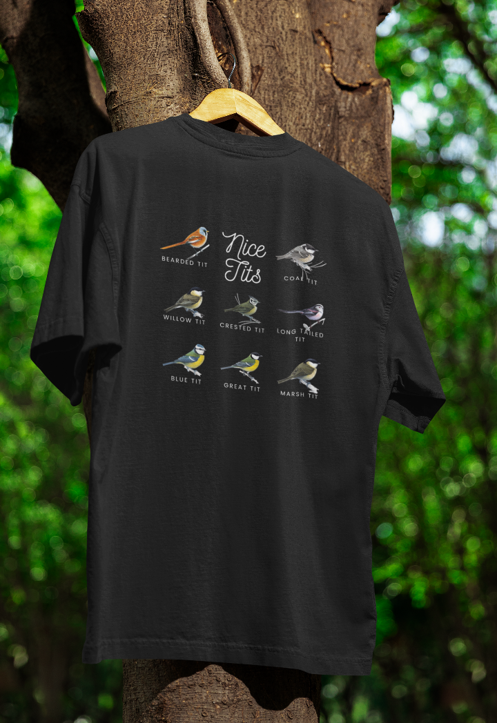 black shirt hanging from a tree with photos of 8 varieties of Tit birds