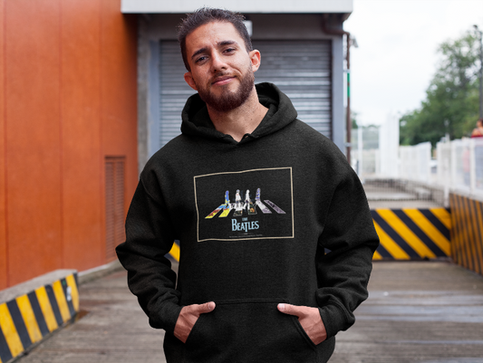 man in a black hoodie with an image of a Beatles album cover on it