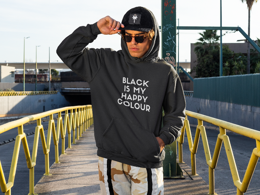 dude on a bridge wearing a black hoodie with words that say black in my happy place