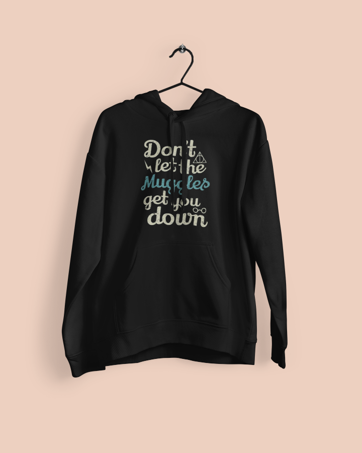 a hanging black hoodie with the words don't let the muggles get you down