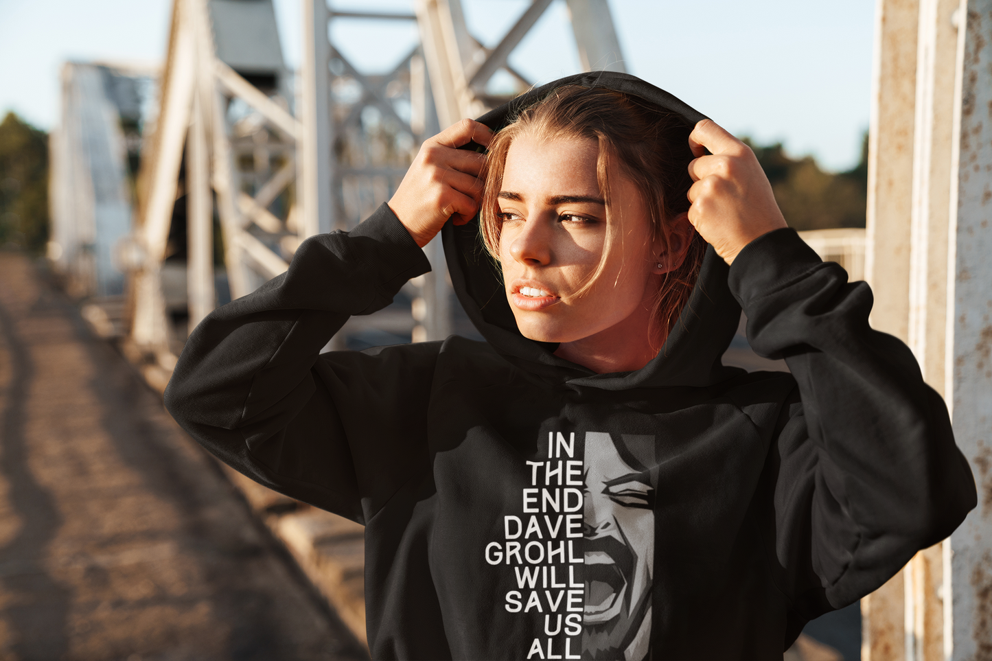 girl in a black hoodie with a picture of dave grohl and the words in the end dave grohl will save us all 