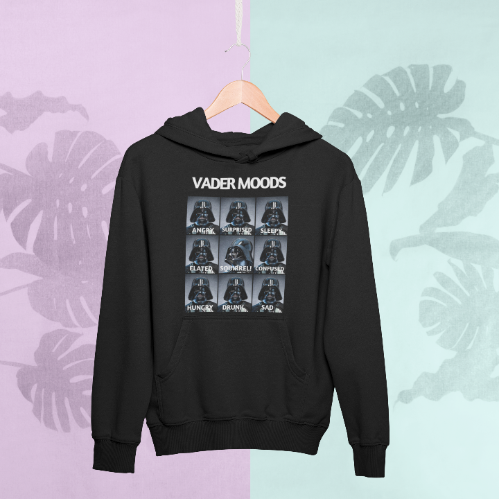 Model is wearing a black hoodie titled vader moods featuring several images of Darth Vader