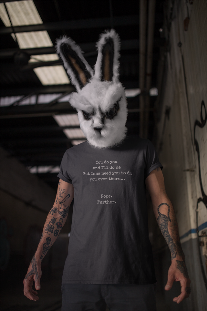 a man with a rabbit mask and a black t shirt that says You do you and I'll do me but Imma need you to do you over there... Nope... Further. 