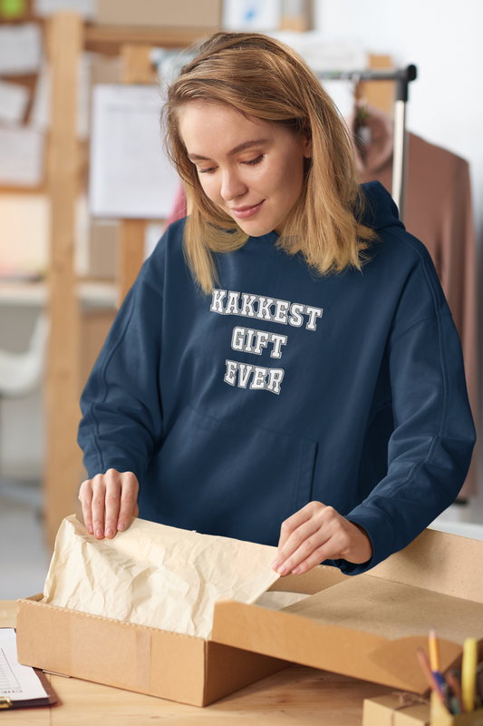 model wearing a navy blue hoodie that says kakkest gift ever